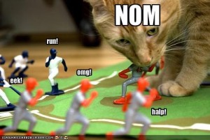 funny-pictures-cat-eats-baseball-players
